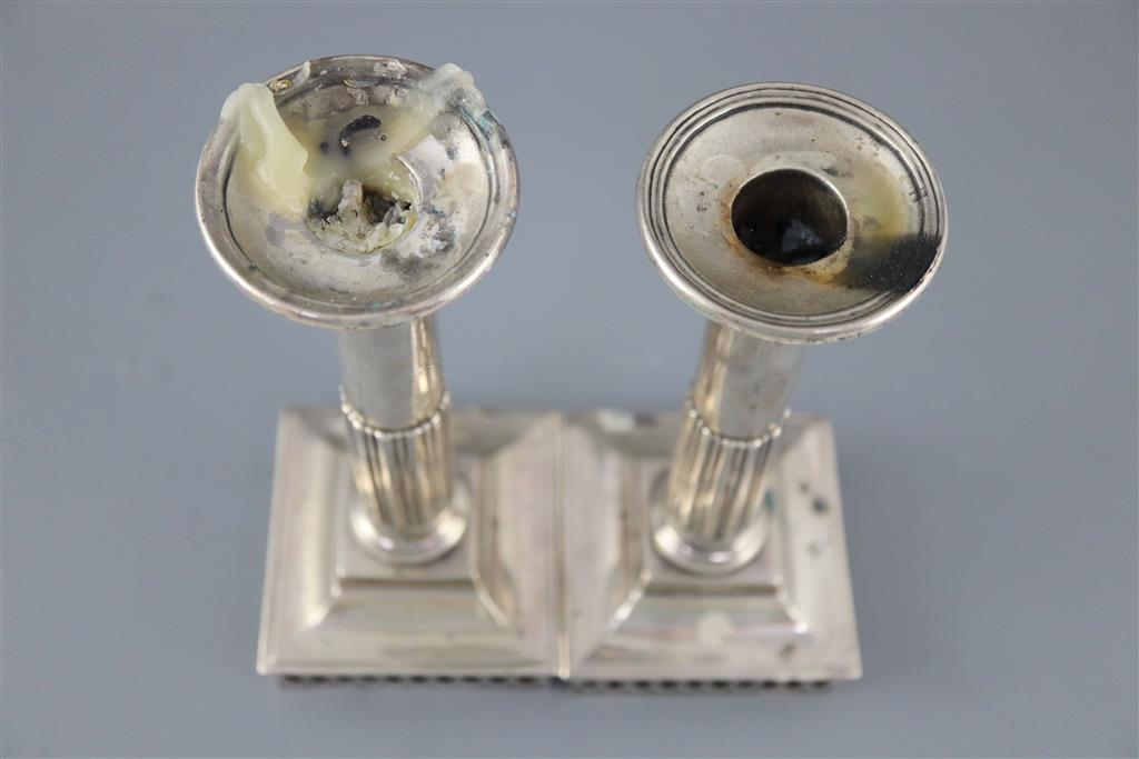 A pair of early 19th century Spanish silver candlesticks, c.1800, ships bases